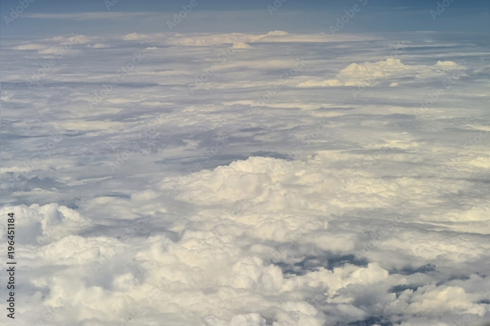 Naklejka premium The top view on clouds from an airplane window