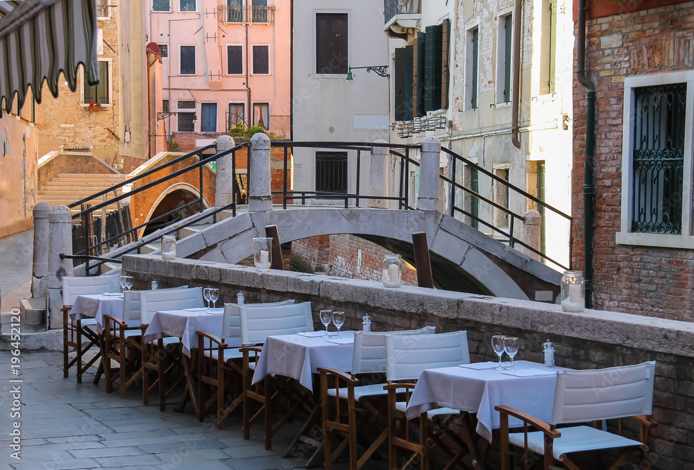 Street cafe in historic centre of Venice, Italy