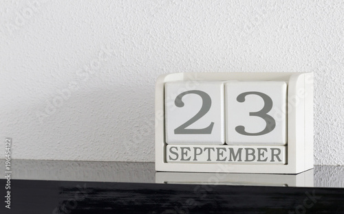 White block calendar present date 23 and month September