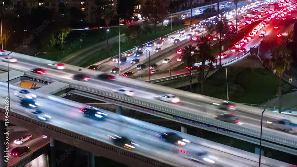 Aerial view of heavy traffic in downtown Los Angeles at night.