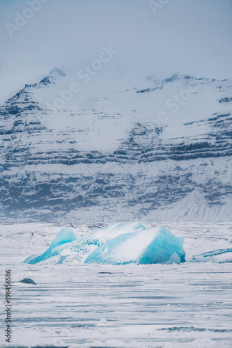 Winter landscape view of popular Glacier Lagoon with many small icebergs - Jokulsarlon, east Iceland. © 1tomm