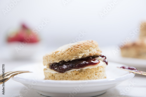 Close-up Scones with butter and strawberry jam