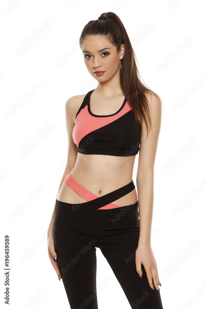 young woman in sportswear on white background young woman in sportswear on white background