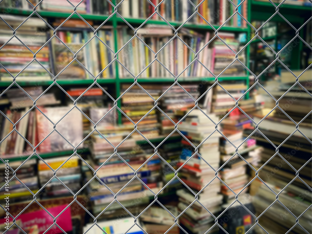 Blurred book in cage in the dark.