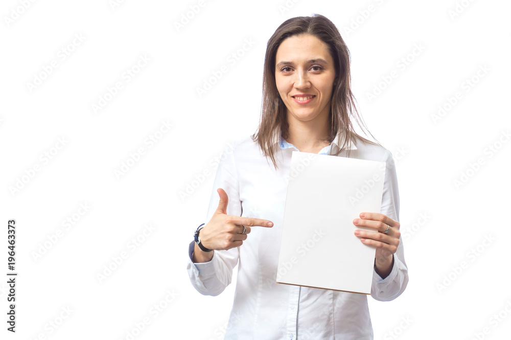 beautiful woman showing a finger at something, on a white background in the studio beautiful woman showing a finger at something, on a white background in the studio