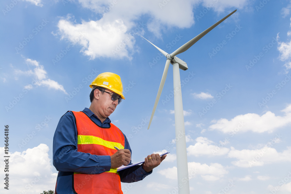Electric Engineer writing report under Wind turbine power Generator Electric Engineer writing report under Wind turbine power Generator
