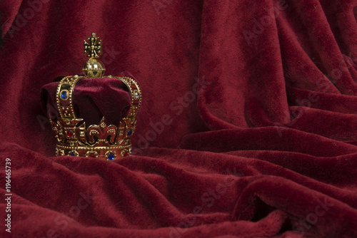 Royal crown on a red velvet background photo