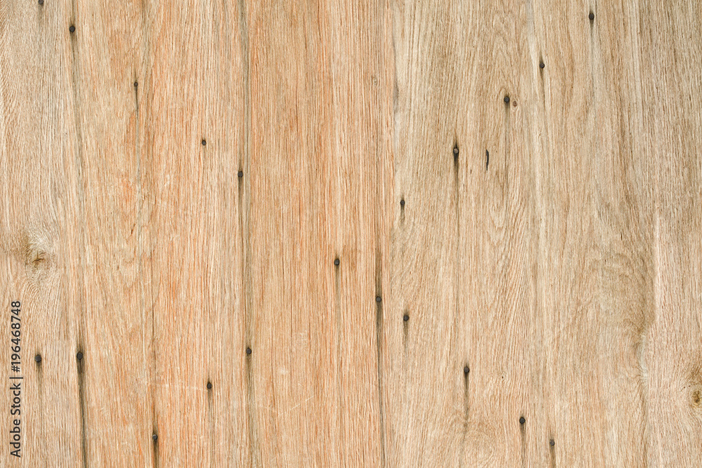 Wooden background with rusted nails