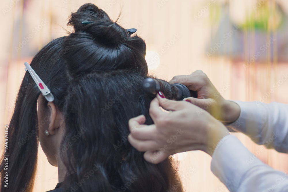 Fototapeta premium Hands of the hairdresser making hairstyle. Barbershop
