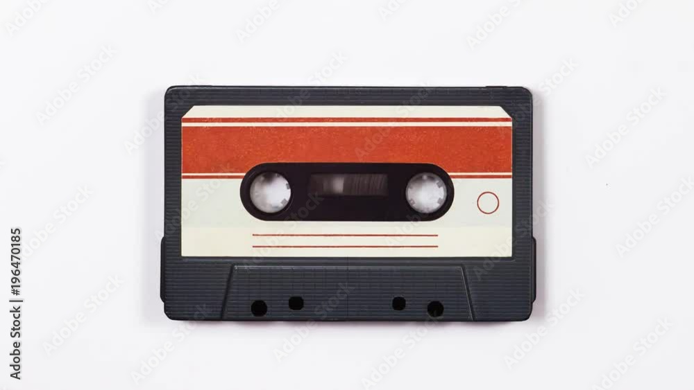 Old tape cassette spin on a white background. 4k. Stop Motion. Old tape cassette spin on a white background. 4k. Stop Motion.