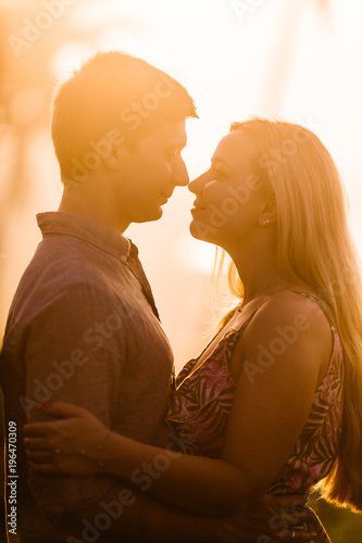 Amazing and happy couple on the sunset