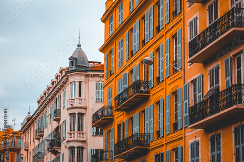 white and orange stucco buildings in a row