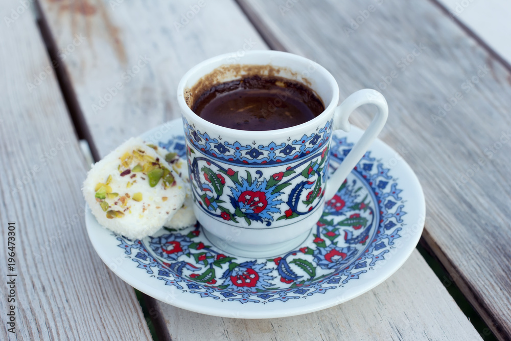 Cup hot black Turkish coffee and traditional sweets. Cup hot black Turkish coffee and traditional sweets.