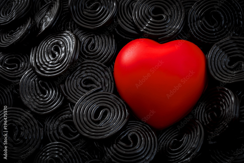 Foto de Black licorice is bad for your health concept with a heart