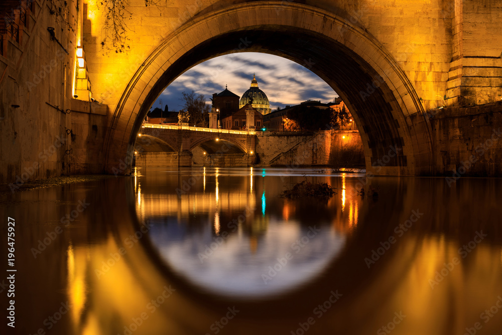 The dome of Saint Peter's Basilica in Vatican, view through the arch of bridge, evening time - obrazy, fototapety, plakaty 