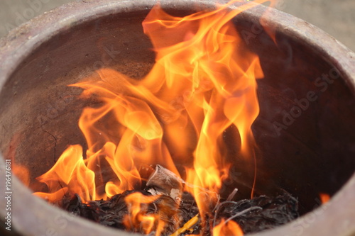 fire burn paper in clay jar
