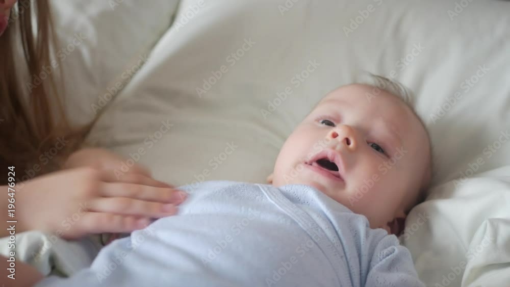 Lovely brother and sister lying in bed at home. Concept of Brother And Sister Together Forever