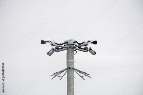 Group of security cameras on pole
