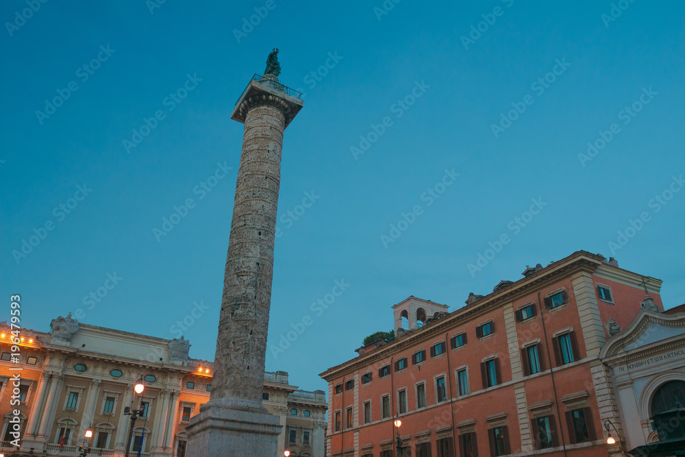 Italian Piazza Colonna with Roman Doric Column of Marcus Aurelius in dusk Rome
