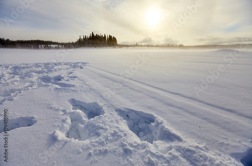 Lake landscape in winter at sunrise.