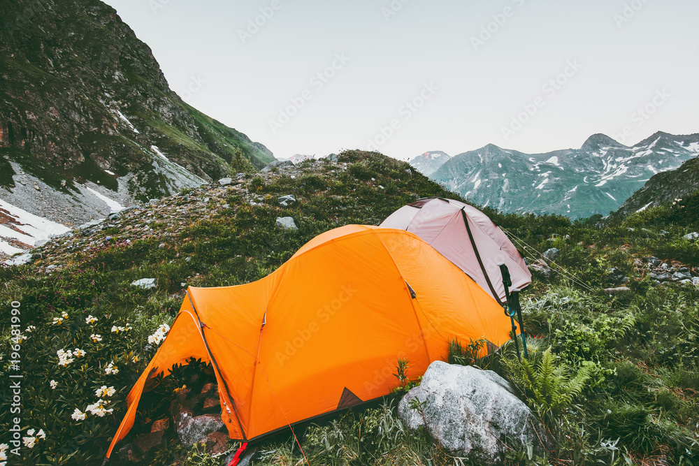 Mountains and camping tents landscape Travel survival Lifestyle concept adventure summer vacations outdoor hiking gear equipment