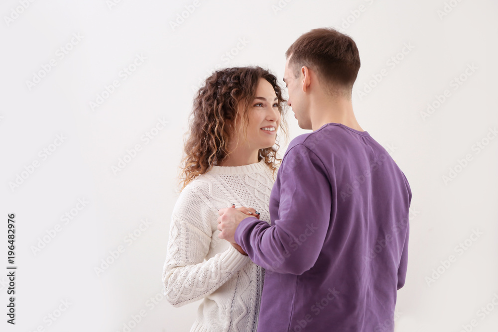 Young loving couple dancing at home on Christmas day Young loving couple dancing at home on Christmas day