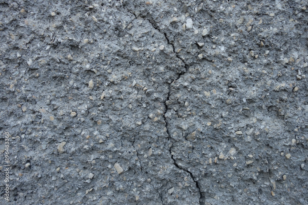 The image of the wall, plastered small stone for use as a background. The image of the wall, plastered small stone for use as a background.