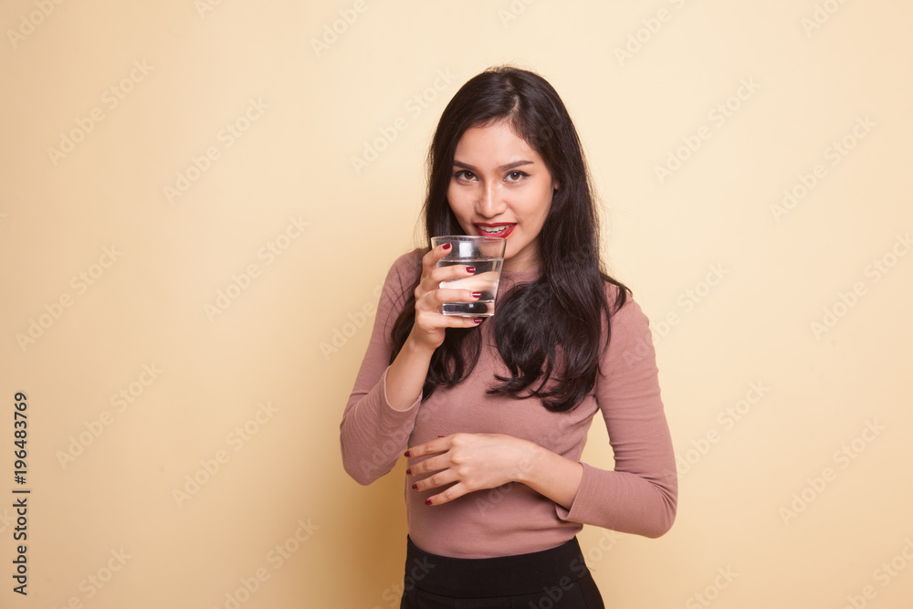 Young Asian woman with tomato juice and red heart. Young Asian woman with tomato juice and red heart.