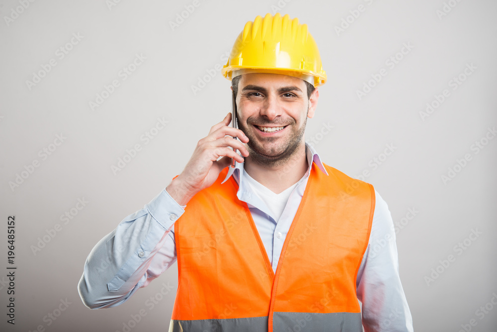 Portrait of young architect talking at smartphone Portrait of young architect talking at smartphone