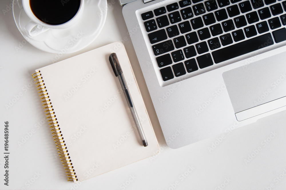 Notepad, laptop with pencil and coffee cup on wood table Notepad, laptop with pencil and coffee cup on wood table