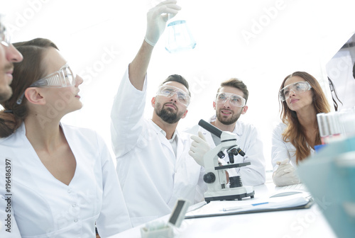 group of young workers are working in biochemistry lab,