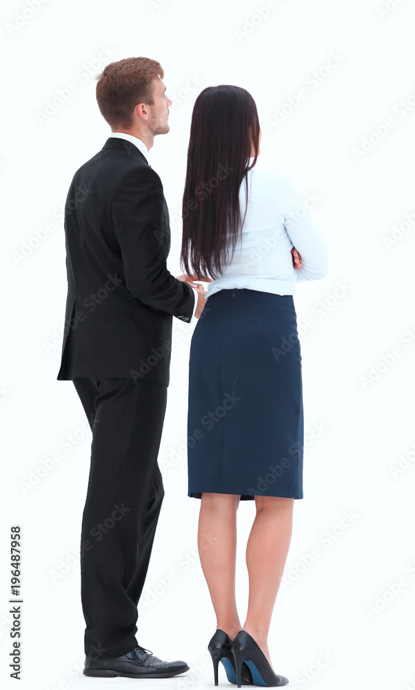 rear view. businessman and business woman standing next to and looking forward. rear view. businessman and business woman standing next to and looking forward.
