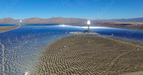 A beautiful aerial over a vast concentrated solar power farm in the Mojave Desert.