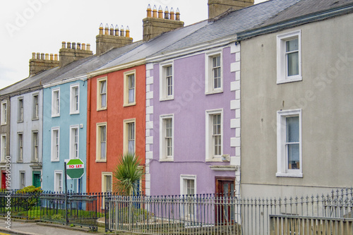 colorful houses with a to let sign