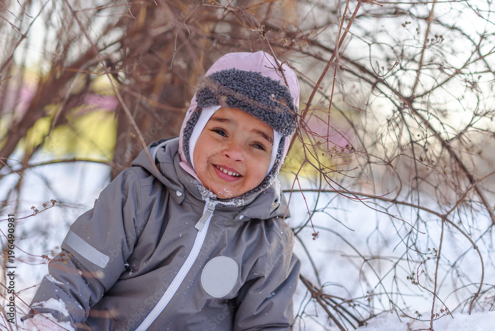 Cute child playing with snow Cute child playing with snow