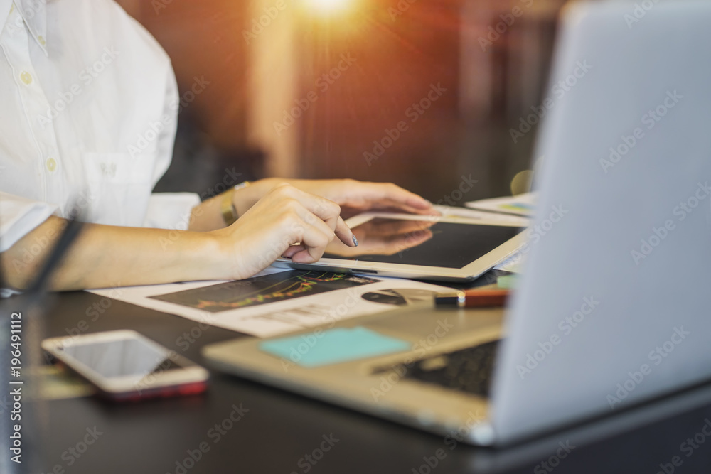 Close up woman hands using and touching on tablet screen Close up woman hands using and touching on tablet screen