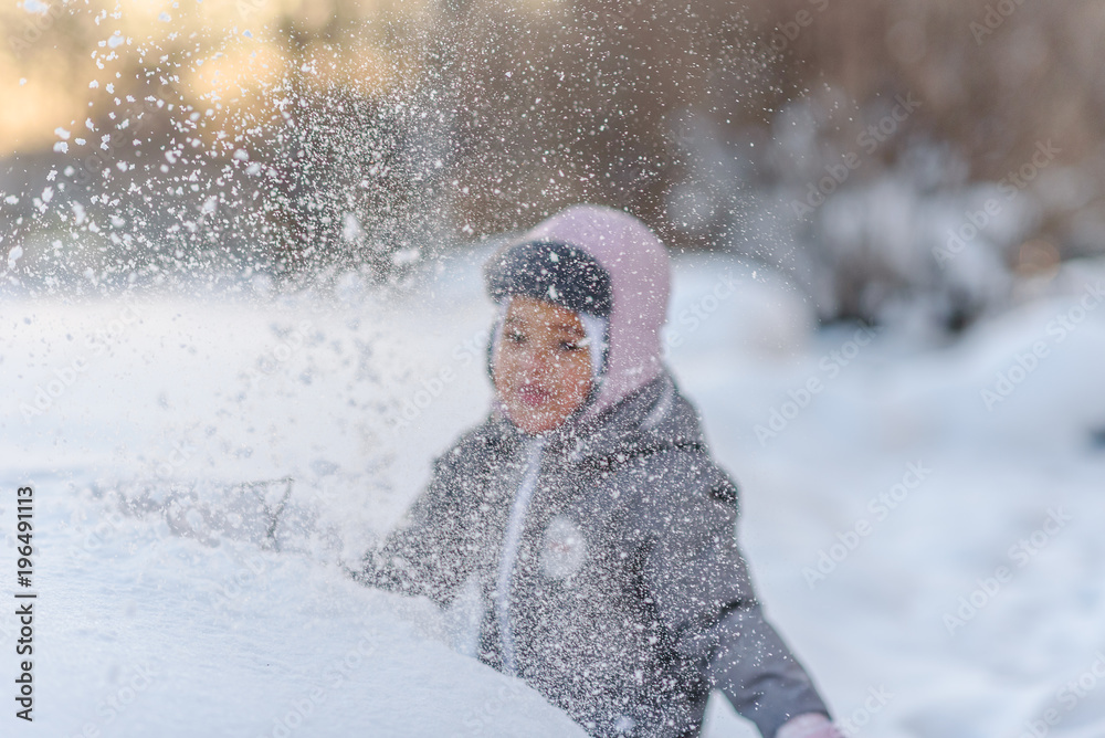 Cute child playing with snow Cute child playing with snow