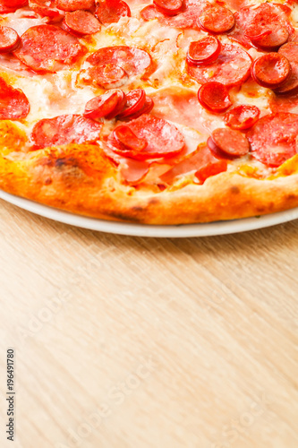 Pizza close up on a wooden table