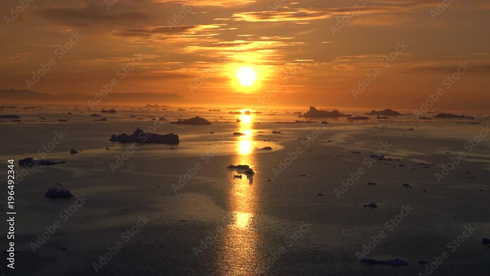Arctic Icebergs on arctic ocean at sunset Arctic Icebergs on arctic ocean at sunset