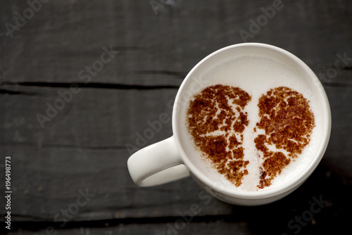 cup of cappuccino with a broken heart photo