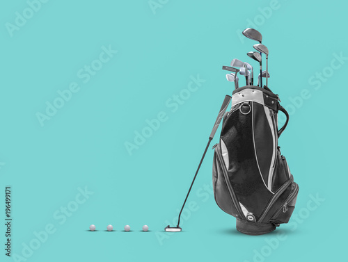 Golf bag ,golf ball and face balanced putter with Super Stroke putter grip on blue background