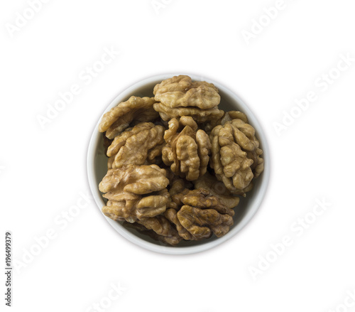 Kernels walnuts isolated on white background. Top view. Walnuts in a bowl isolated on white background. Walnuts with copy space for text.