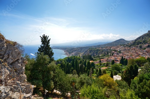 Taormina, Italy, Sicily August 26 2015. The splendid panorama from the Greek theater, towards the sea. Lush nature, Mediterranean vegetation, flowers. Sea and boats.