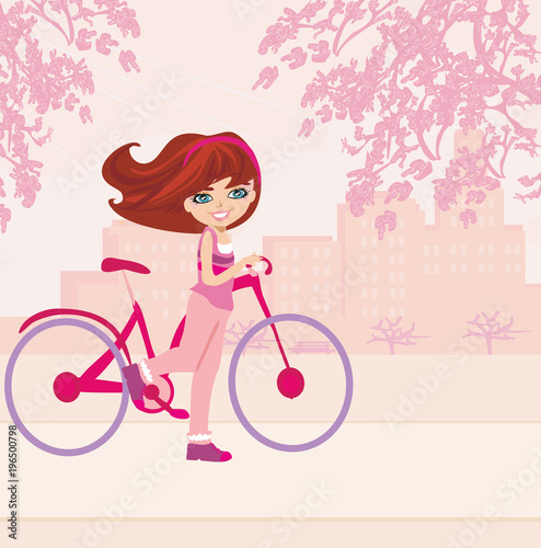Young girl with bicycle