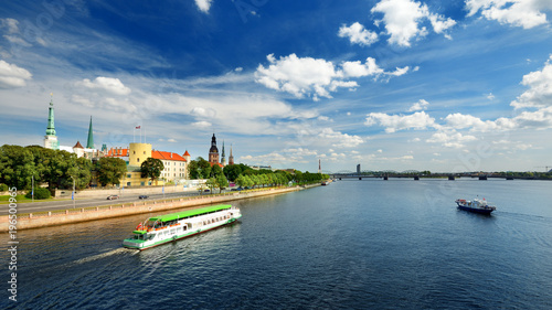 general view on Riga embarkment and river ships in bright sunny day, Latvia