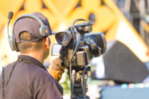 blurred professional cameraman - covering the event with a video Live and record video 