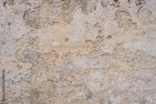 Stone surface of a dark yellow sandstone - background  texture