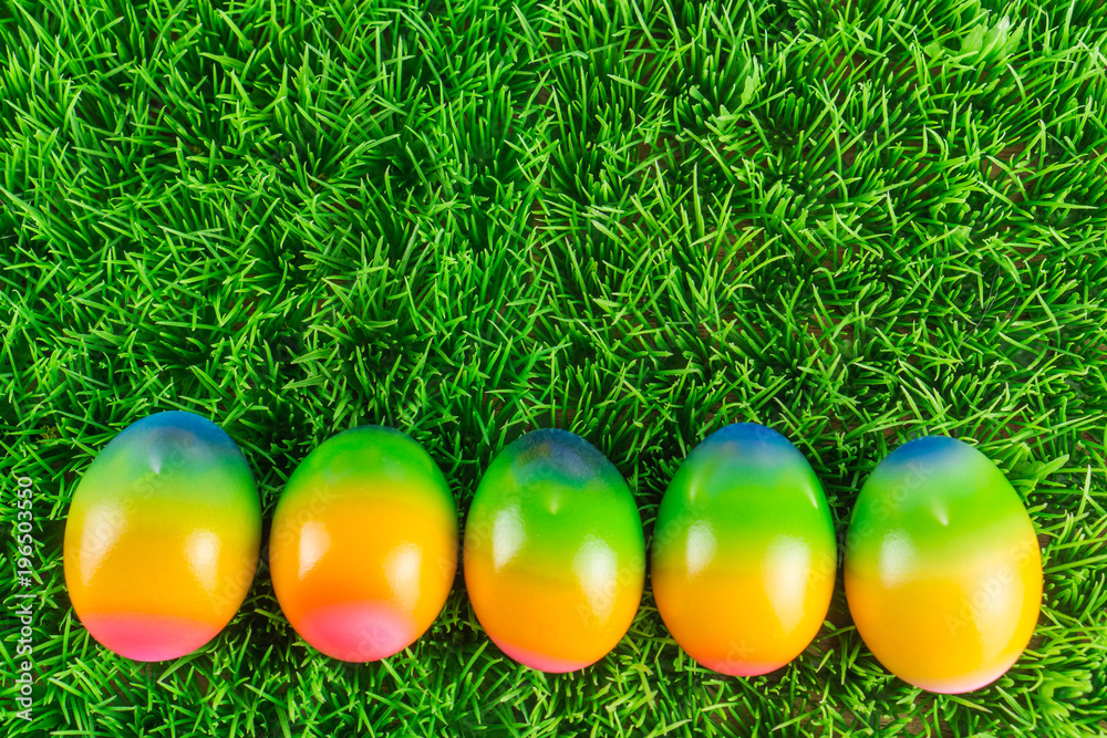 Colorful Easter eggs in the meadow