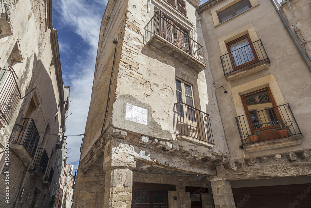 Street view, ancient facade houses in medieval village of Santa Coloma de Queralt, province Tarragona,Catalonia.Spain.