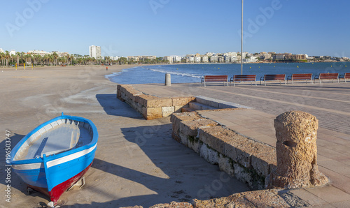 Mediterranean beach and fishing boats in catalan town of Salou, Costa Daruada, province Tarragona,Catalonia.Spain.